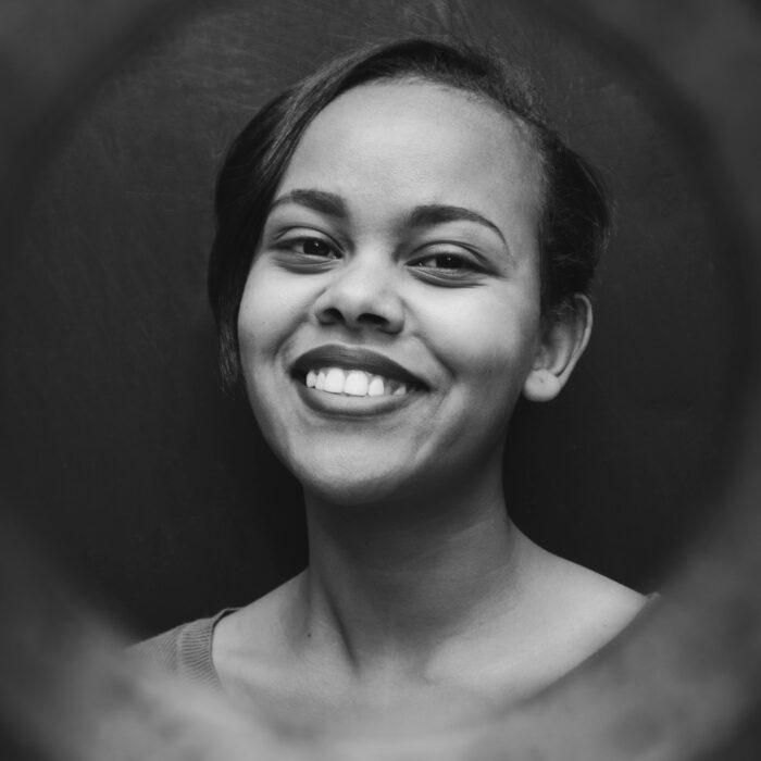 A Gray-scale picture of a black woman smiling